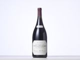 a bottle of wine that is sitting on a table