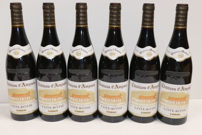 six bottles of wine are lined up in a row on a table