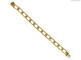 a close up of a gold chain bracelet on a white background