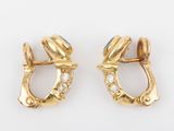 an image of a pair of gold and diamond earrings