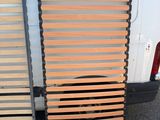 two wooden slats on the back of a white van