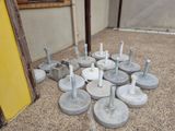 a lot of concrete poles that are sitting on the ground