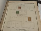 a sheet of paper with stamps on it sitting on a desk