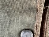 an image of a close up of a bag with a button on it