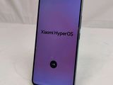 a close up of the back of a phone with a purple screen