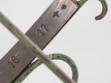 a pair of scissors sitting on top of a metal object
