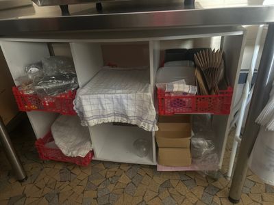 a kitchen counter with a bunch of items on top of it