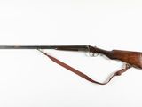 a rifle on a white background with a brown strap