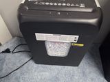 an image of a paper shredder sitting on the floor