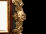 a picture of a mirror that is hanging on the wall