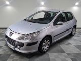 a picture of a small silver car parked in a garage