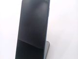 a cell phone that is sitting on top of a stand