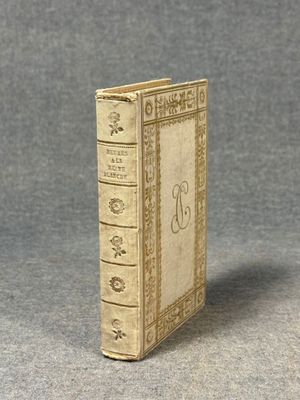a miniature book that is sitting on a table