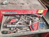 many tools in a tool box on the table