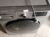 a broken oven sitting on the floor in the kitchen