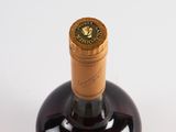 a bottle of wine that is sitting on a table