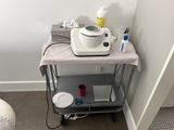 an image of a small table with a hair dryer on it