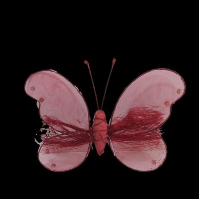 a pink butterfly that is sitting on a black surface