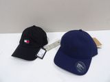 two hats are sitting next to each other on a table