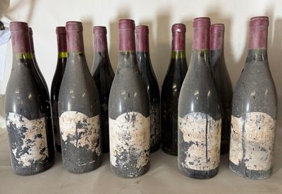six bottles of wine are lined up in a row on a table