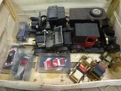 a box full of toy trains sitting on the floor