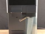 a coffee machine that is sitting on a wooden table