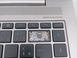 a close up of a laptop keyboard with a small chip on it