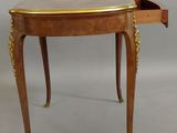 an image of a small table with a drawer on it