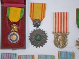 many medals and medals on display on a table