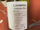 a bottle of wine that is being held by a person