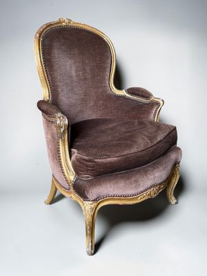 an image of a chair with a brown upholstered seat