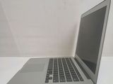 a laptop computer sitting on a table with a white background
