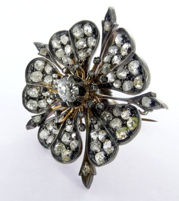 an image of a diamond flower broochle on a white background