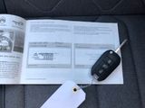 a book with a car key and a car key on it