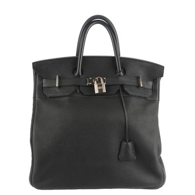 a black leather handbag on a white background