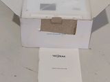a white box with a piece of paper inside of it