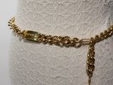 a close up of a mannequin torso with a chain around it