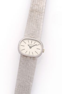 an image of a silver wrist watch with a white face