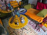 a yellow table with a hook on it in a living room