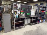 a metal workbench in a garage with lots of items on it