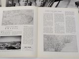an open book with black and white photos of people and a map