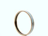 an image of a close up of a ring on a white surface
