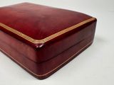 a red box with a gold stripe on it