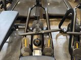 an image of a row of stationary exercise machines in a gym