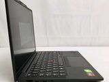 a black laptop computer sitting on a white surface