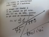 a person writing on a piece of paper with a pen