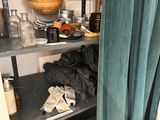 a shelf that has a lot of items on it