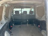 the back of a van with four seats in the back of it