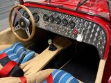 a red car with leather seats and a steering wheel