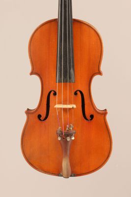an old violin with a bow hanging from it ' s back